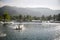 view of shrimp farm with rotating water wheel, mountains background, tambak udang.