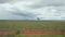 View from the side window of a car driving on the road passing by landscapes of rural areas