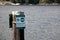 View of sign `Loading zone 30 minutes` on a pier in Belcarra Regional Park