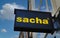 View on sign with logo lettering of sacha footwear fashion at store entrance