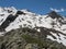 View from Simmingjochl mountain saddle on sharp snow-capped peaks at Stubai hiking trail, Stubai Hohenweg, Alpine