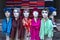 View of six mannequins from their waist to head, covered with colorful scarves and headscarves, as seen in a shop window in Istanb