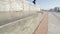 View on Skatestopper or anti-skate device on street granite ledge on monument