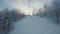 View from ski lift to beautiful snowy slopes and fluffy white trees on roadsides