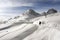 A view of a ski piste and resort in the snow covered landscape and mountains in the alps switzerland st moritz in winter