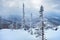 View of ski resort Sheregesh from Utya mountain. Snowdrifts and snow-covered trees in fluffy snow, sky in clouds