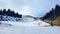 View of the ski slope and the ski lift on the mountainside.