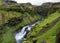 View on Skoga river with waterfall in rainy summer day on the Fimmvorduhals trail from Skogar to Thorsmork, Highlands of Iceland