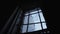 View of the Sky through the Barred Window with the Web in the Old Cellar of the Abandoned Prison