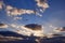 View of the sky of Jeju Island during sunrise with eagle shaped clouds with sun ray penetrating from behind