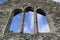 View of the sky through the window of the destroyed church.