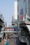 View of skybridge or overhead pedestrian walkway linking Asok BTS Station to the Terminal 21 mall on the right, Bangkok