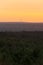 View of the skyline of Berlin, Germany in sunrise seen from lookout platform Wietkiekenberg on the lake Schwielowsee over vast