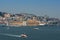 View of the skyline of the city of Lisbon with boats cacilheiro on the Tagus River;