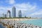 View of skyscrapers, South Pointe Park Pier and South Beach with sunbathers enjoying sun, beach and Atlantic Ocean. Miami, Florida