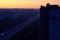 View of the sleeping city of Togliatti and a strip of dawn sky from a height of the 16th floor of a residential building.