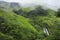 A view of Slide Waterfall, also known as Catarata El Tobogan, can be seen from the hiking trail at Viento Fresco in Costa Rica.