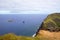 View of the slopes of the crater of Rano Kau in Easter Island with rock islets of Motu Kao Kao, Motu Iti and Motu Nui. Easter