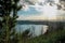 View of the slopes, forests and hills of Lake Albano in a cloudy sunset.