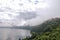 View of the slopes, forests and houses of Lake Albano on a cloudy and foggy day.