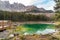 View of a small alpine Lake Carezza o Karersee located in Nova Levante, province of Bolzano in Dolomites, South Tyrol