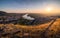 View of Small City with River from the Hill at Sunset