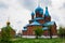 View of small Orthodox church wih blue domes in Russia