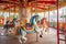 view of a small spinning carousel horses ride