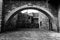 View of a small square in Spello town Umbria, Italy, with an arch filling almost the whole image