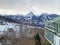 View of the small subalpine agricultural and tourist resort of Amden with the Glarus Alps massif in the background - Switzerland