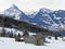 View of the small subalpine agricultural and tourist resort of Amden with the Glarus Alps massif in the background - Switzerland