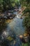 View of small waterfall lagoon in the middle of the forest at the Itatiaia Park.