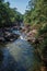 View of small waterfall lagoon in the middle of the forest at the Itatiaia Park.