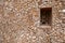 View of a small window on a traditional Swahili wall in Lamu Island, Kenya