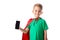 View of smiling preschooler kid in red hero cloak showing smartphone with blank screen isolated on white