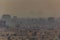 View of smoggy Cairo skyline with pyramids in the background, Egy