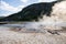 View of smoke emitting from hotspring at Yellowstone national park in summer