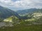 View from Smutne sedlo on mountain valley Smutna dolina with rock boulders, footpath trail, dwarf scrub pine and green