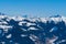 View of the snow-capped mountains in the Schmitten ski area in Zell am See. In the background is a beautiful sky with clouds