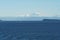 View on snow covered mountain from merchant vessel approaching Vancouver, British Columbia  from Pacific ocean.