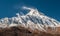 View of snow covered peak of Mount Manaslu 8 156 meters with clouds in Himalayas, sunny day at Manaslu Glacier in Gorkha, Nepal