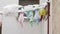 View of a snow covered towels and clothes drying outside during a snowfall