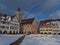 View of snow-covered town square of Freudenstadt, Black Forest with city hall and the famous arcades on sunny day.