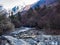 View of snow mountain and small stream in Siguniang National Par