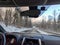 view of snowed road in mountains range car travel concept