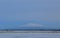 View of a snowy capped mountain in winter from afar