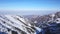 View from the snowy gorge in the mountains to the clouds and the city smog.