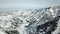 A view of the snowy hills with firs. Winter in the mountains.