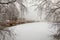 View at the snowy ice of a small lake