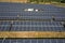 View of a solar farm with rows of panels